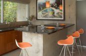 Clarke Residence building interior kitchen with orange stools